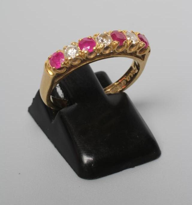 A RUBY AND DIAMOND HALF HOOP ETERNITY RING Image