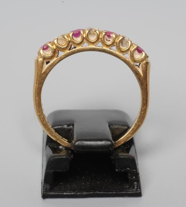 A RUBY AND DIAMOND HALF HOOP ETERNITY RING Image