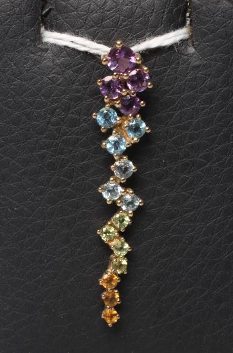 A MULTI-GEM PENDANT of elongated abstract form point set with amethysts Image