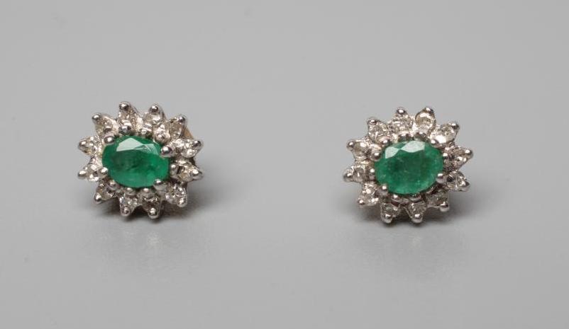 A PAIR OF EMERALD AND DIAMOND CLUSTER EAR STUDS Image