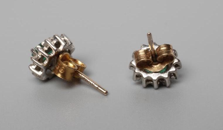 A PAIR OF EMERALD AND DIAMOND CLUSTER EAR STUDS Image
