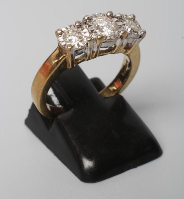 A THREE STONE DIAMOND RING Image