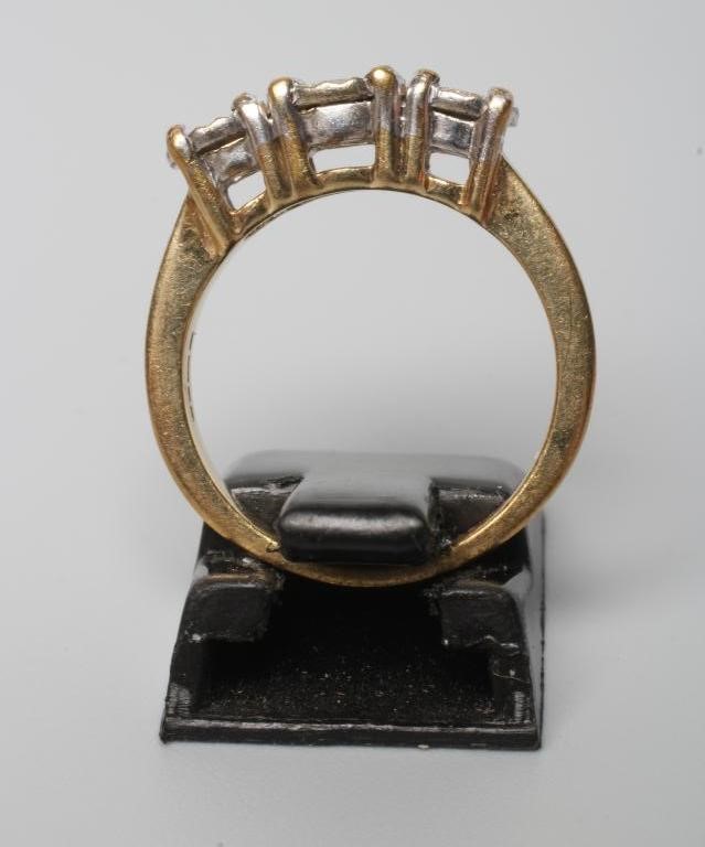 A THREE STONE DIAMOND RING Image