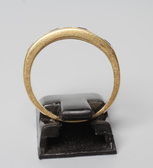 A SAPPHIRE AND DIAMOND HALF HOOP ETERNITY RING Image