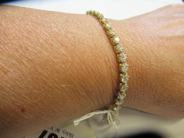 A DIAMOND TENNIS BRACELET Image