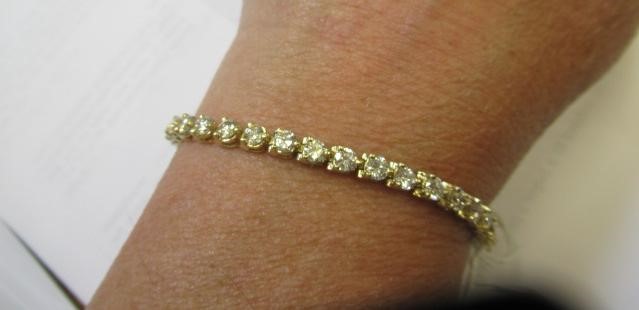 A DIAMOND TENNIS BRACELET Image