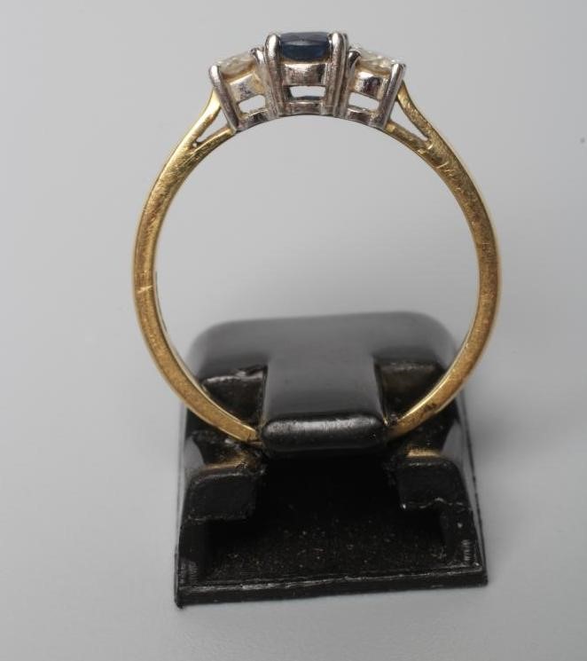 A SAPPHIRE AND DIAMOND THREE STONE RING Image
