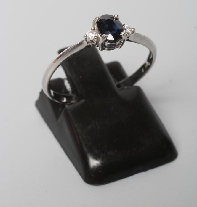 A SAPPHIRE AND DIAMOND THREE STONE RING Image