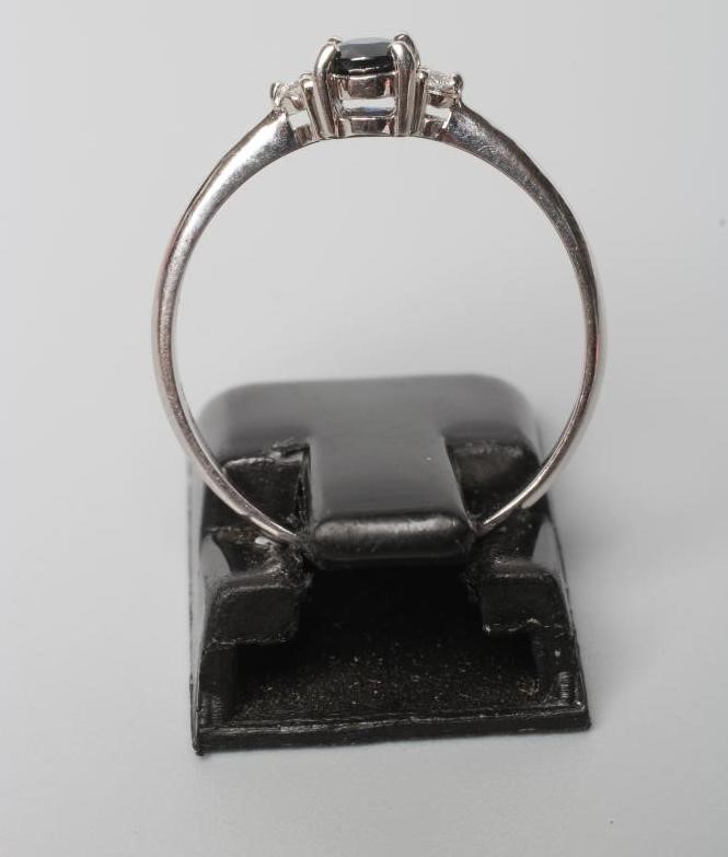 A SAPPHIRE AND DIAMOND THREE STONE RING Image