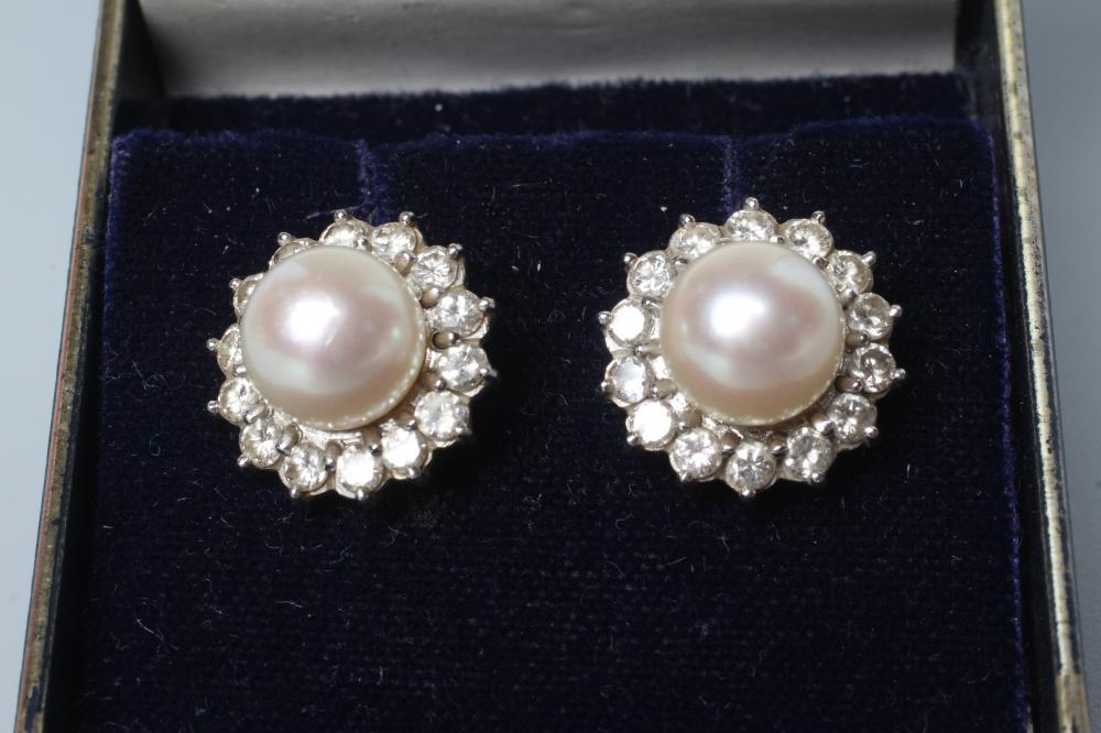 A PAIR OF PEARL AND DIAMOND CLUSTER EAR STUDS Image