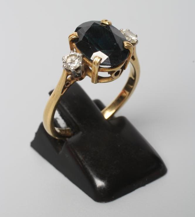 A SAPPHIRE AND DIAMOND THREE STONE RING Image
