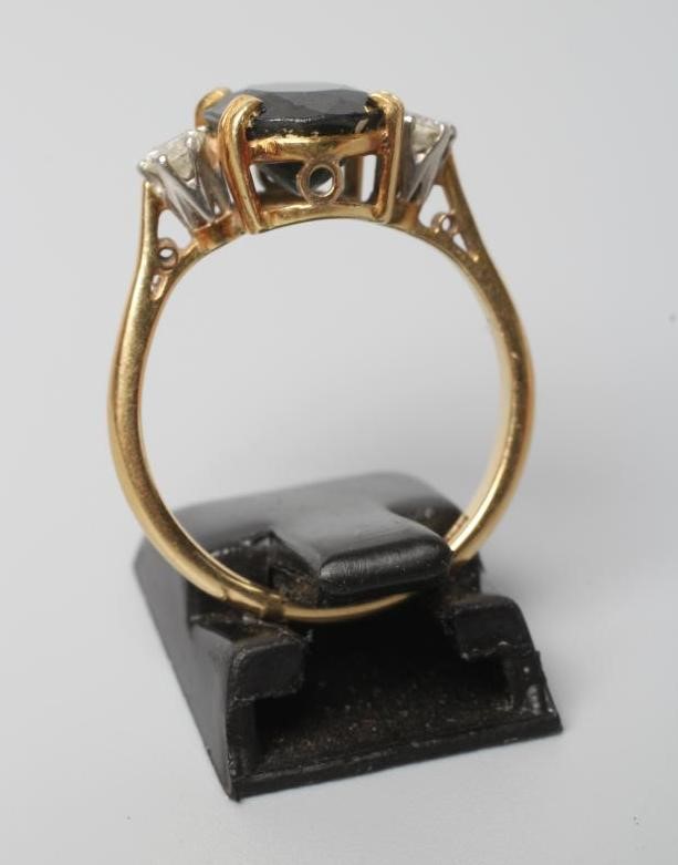 A SAPPHIRE AND DIAMOND THREE STONE RING Image