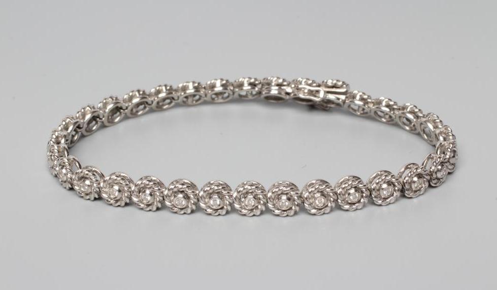 A DIAMOND TENNIS BRACELET Image