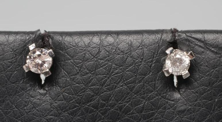 A PAIR OF DIAMOND SOLITAIRE EAR STUDS Image