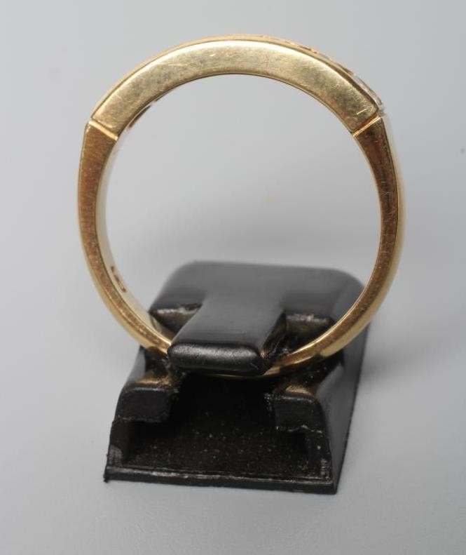 A MULTI GEM HALF HOOP RING Image