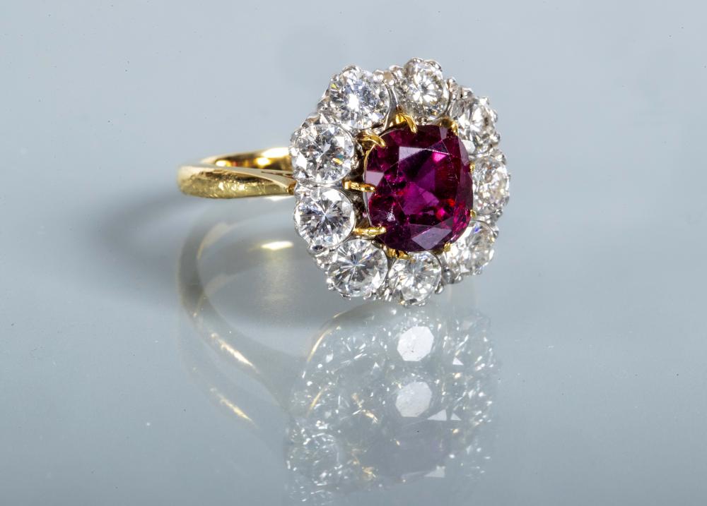 A RUBY AND DIAMOND CLUSTER RING Image