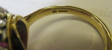 A RUBY AND DIAMOND CLUSTER RING Image