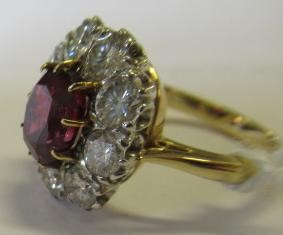 A RUBY AND DIAMOND CLUSTER RING Image