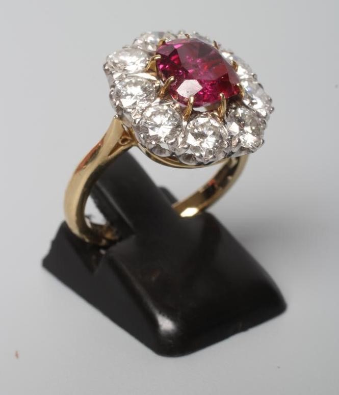 A RUBY AND DIAMOND CLUSTER RING Image