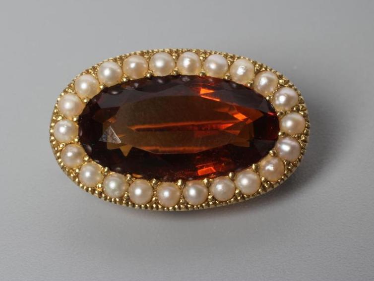 AN EDWARDIAN CITRINE AND SEED PEARL BROOCH Image