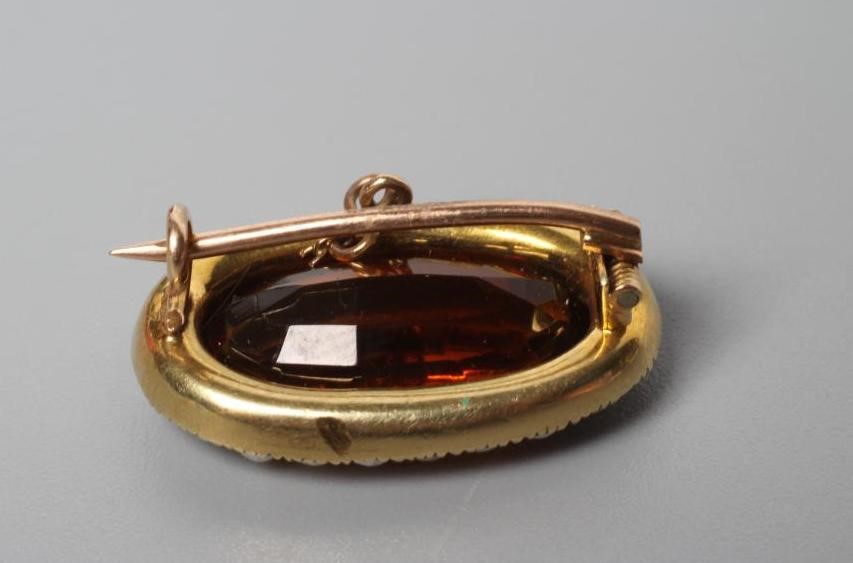 AN EDWARDIAN CITRINE AND SEED PEARL BROOCH Image