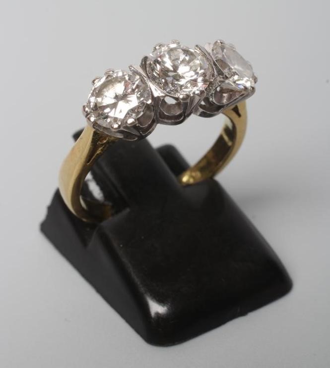 A THREE STONE DIAMOND RING Image