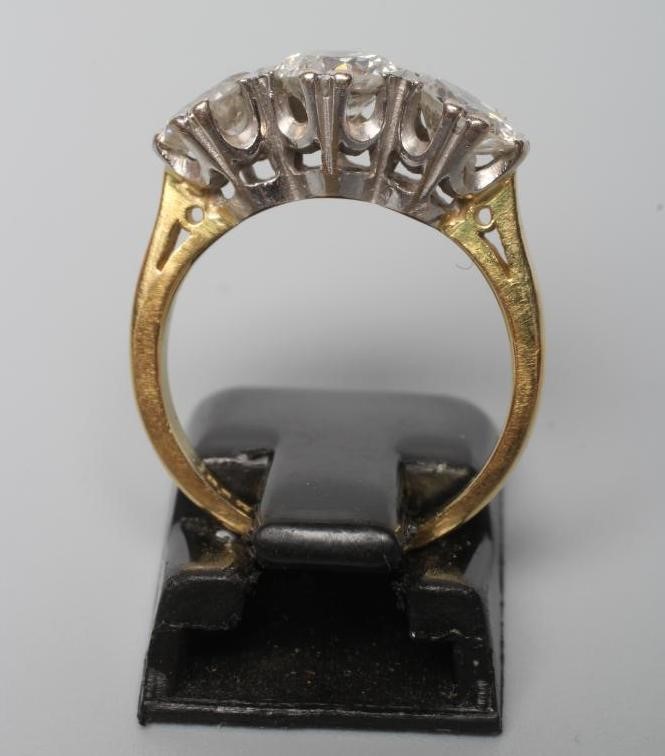 A THREE STONE DIAMOND RING Image