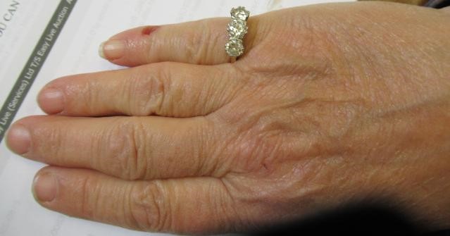 A THREE STONE DIAMOND RING Image