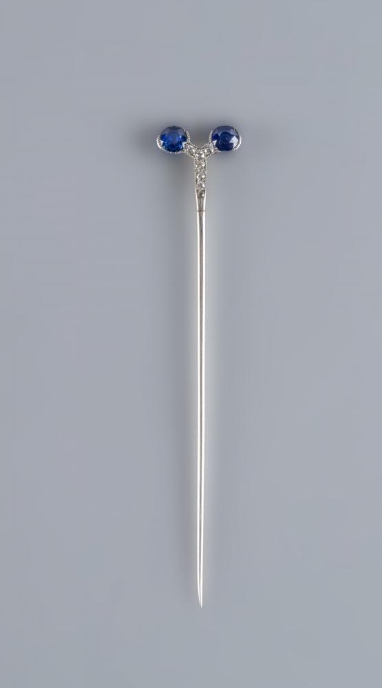 A CARTIER SAPPHIRE AND DIAMOND STICK PIN by Henri Droguet Image