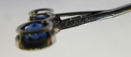 A CARTIER SAPPHIRE AND DIAMOND STICK PIN by Henri Droguet Image