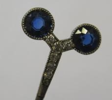 A CARTIER SAPPHIRE AND DIAMOND STICK PIN by Henri Droguet Image