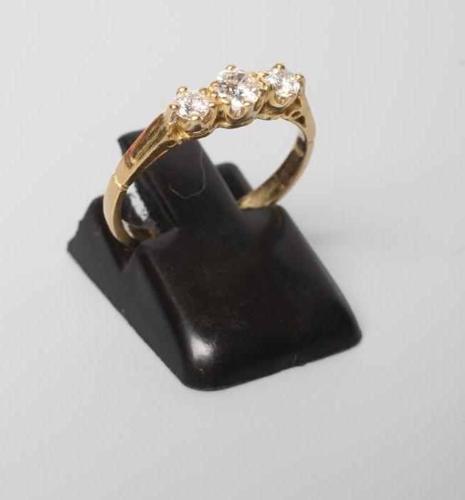 A THREE STONE DIAMOND RING Image