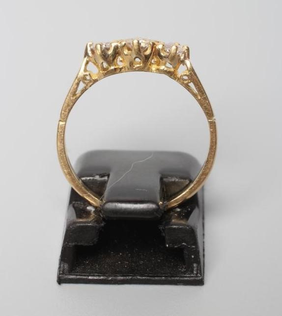 A THREE STONE DIAMOND RING Image