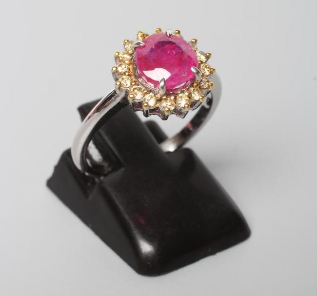 A RUBY AND DIAMOND CLUSTER RING Image