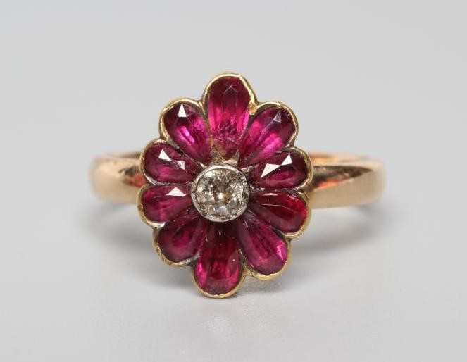 A VICTORIAN GARNET AND DIAMOND CLUSTER RING Image