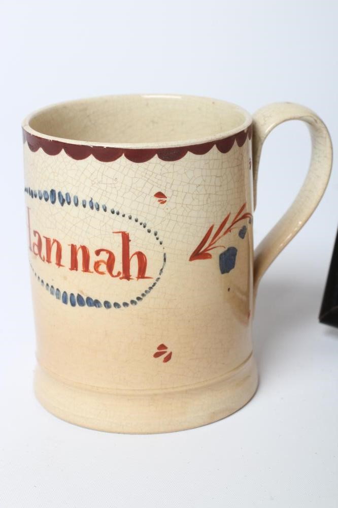 A NAMED CREAMWARE MUG Image