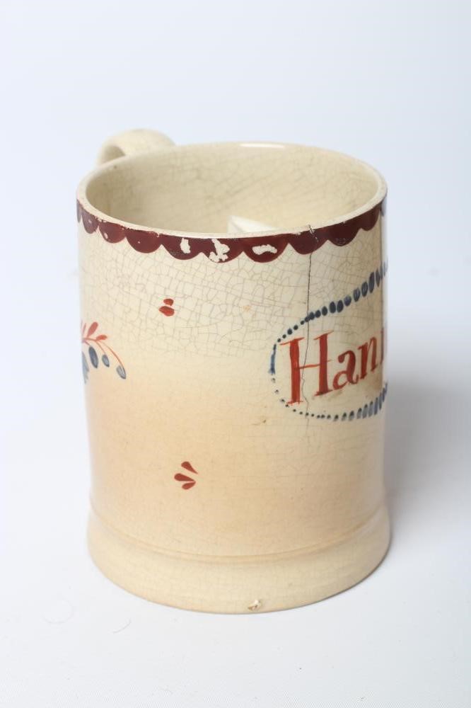 A NAMED CREAMWARE MUG Image