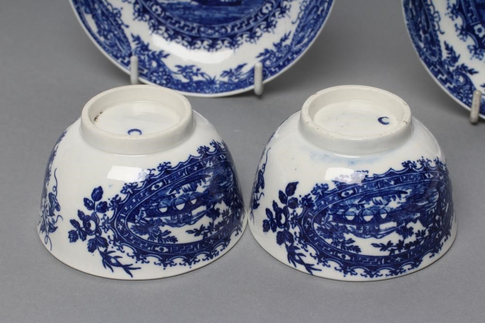 A PAIR OF FIRST PERIOD WORCESTER PORCELAIN CIRCLED LANDSCAPE PATTERN TEA BOWLS AND SAUCERS Image