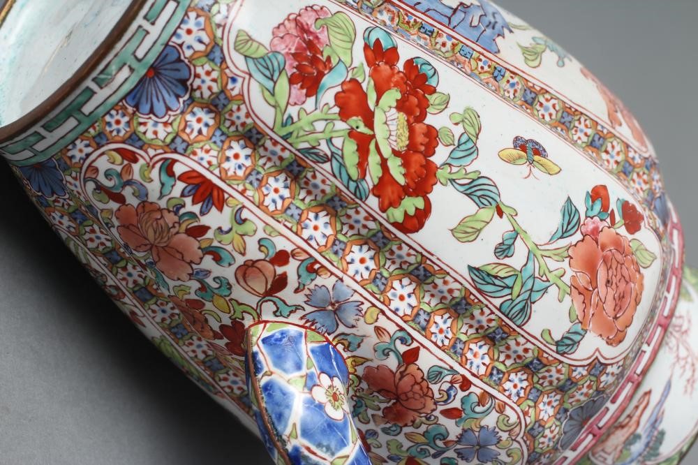 A CANTON ENAMEL WINE POT AND COVER of lobed cylindrical form with slender angular handle and curved Image