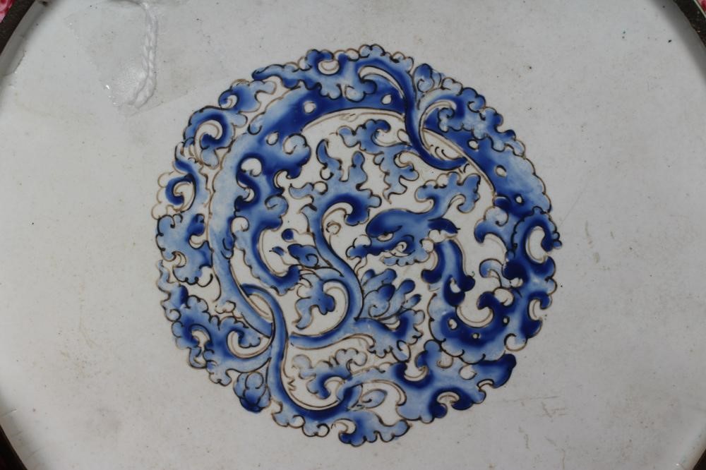 A PAIR OF CANTON ENAMEL SAUCER DISHES centrally painted in pastel colours with figures in extensive Image