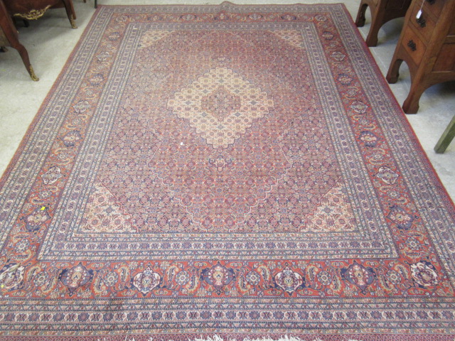 A PERSIAN TABRIZ CARPET Image