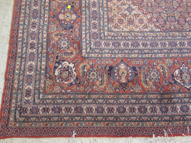 A PERSIAN TABRIZ CARPET Image