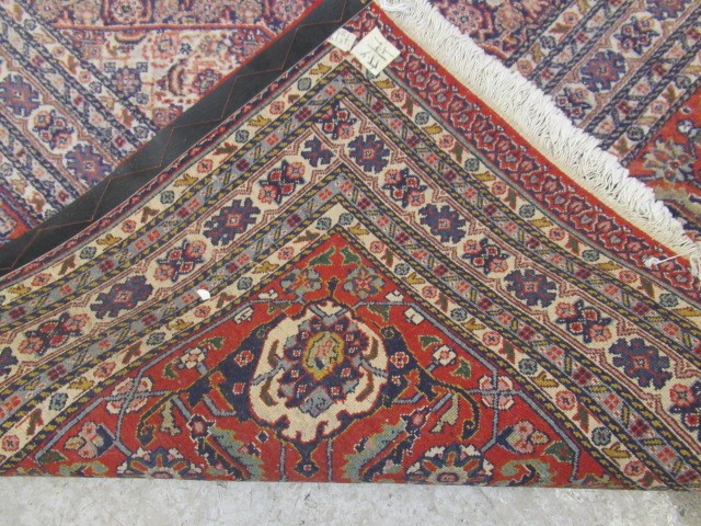 A PERSIAN TABRIZ CARPET Image