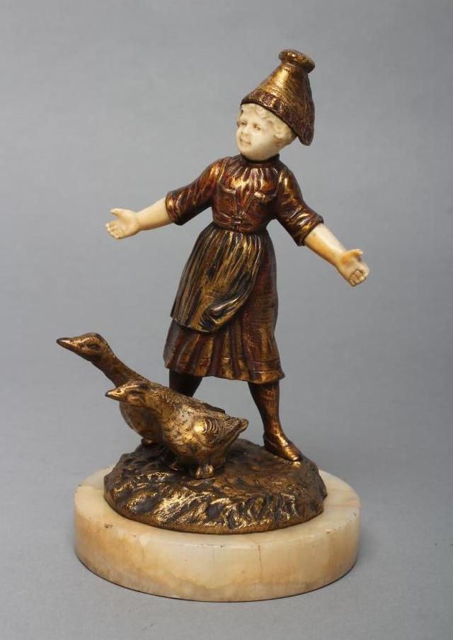 AFTER BAILLY - a cast and gilded bronze figure of a young Dutch girl with carved ivory head and Image