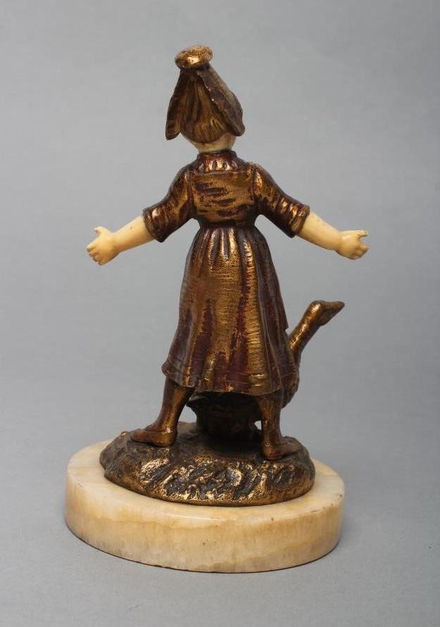 AFTER BAILLY - a cast and gilded bronze figure of a young Dutch girl with carved ivory head and Image