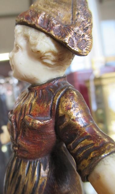 AFTER BAILLY - a cast and gilded bronze figure of a young Dutch girl with carved ivory head and Image