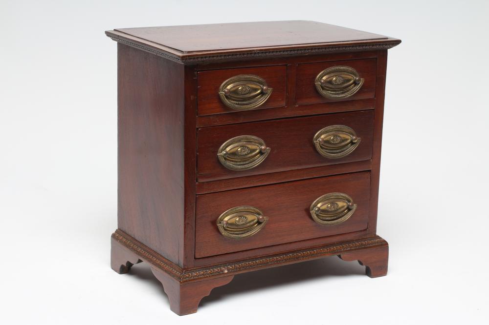 A MAHOGANY MINIATURE CHEST Image