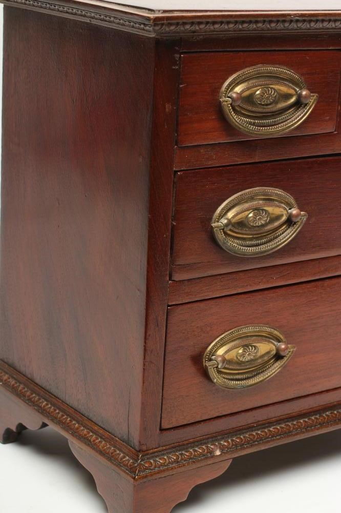 A MAHOGANY MINIATURE CHEST Image