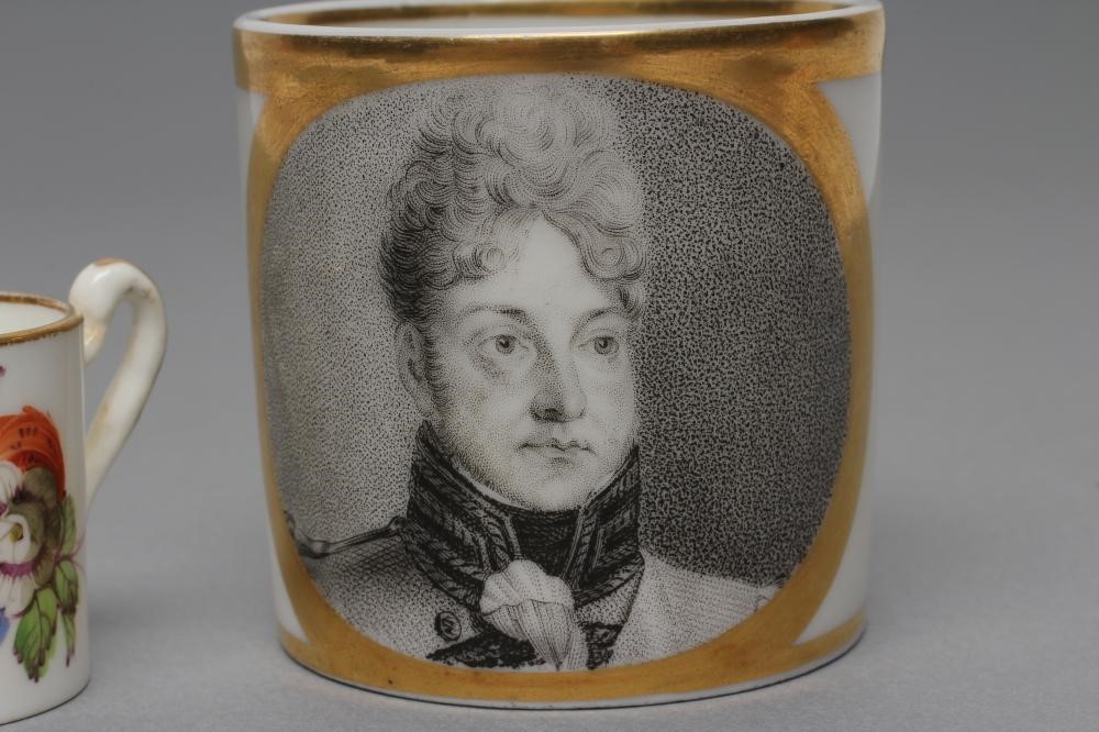 OF ROYAL INTEREST- a French porcelain coffee can painted in black monochrome with the head and Image