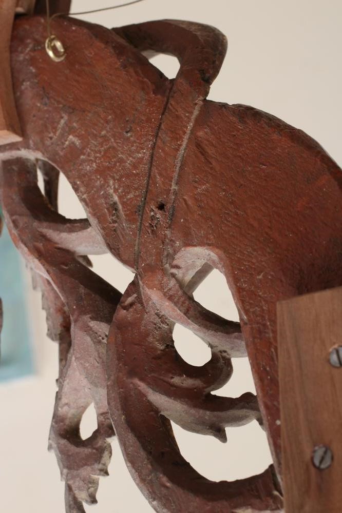 A CARVED AND GILT WOOD INDIAN FRAME of arched oblong form Image